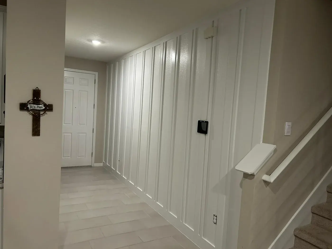 The same hallway finished in white board and batten