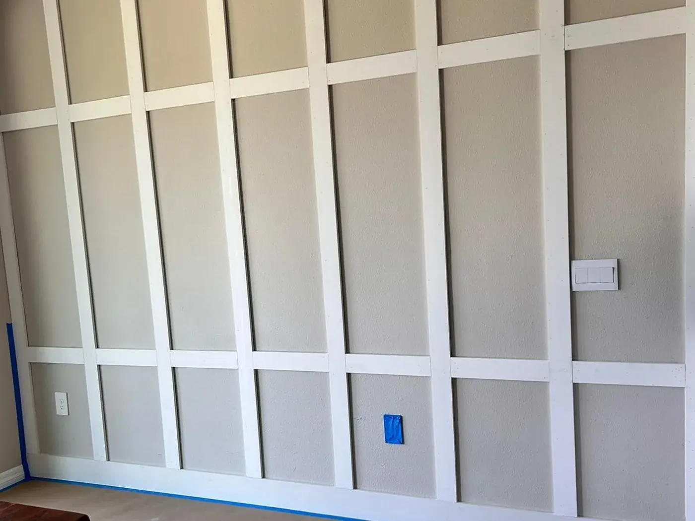 Dining room wall with battens fixed to the wall, still unpainted