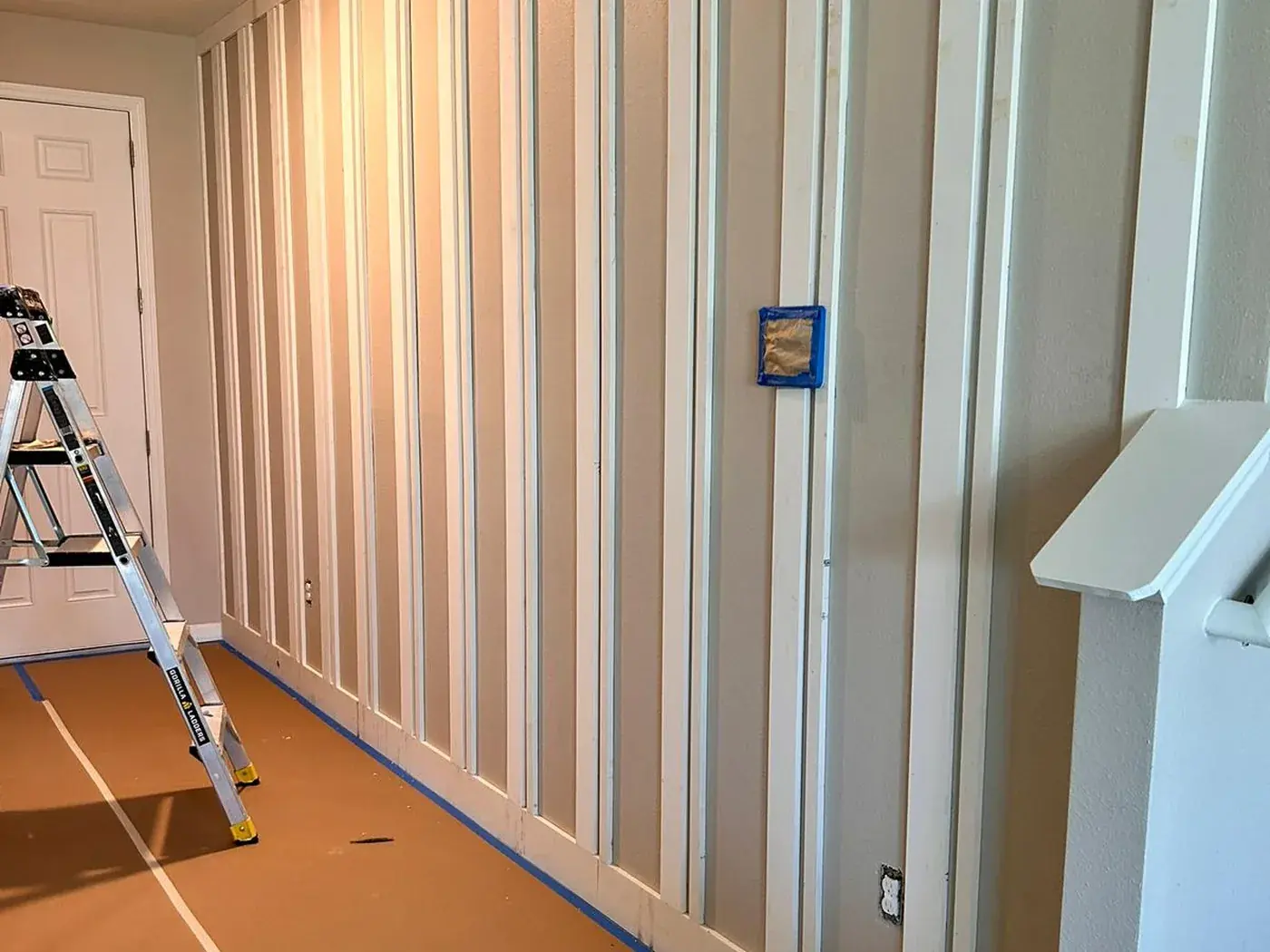 Hallway with battens installed and the floor papered off