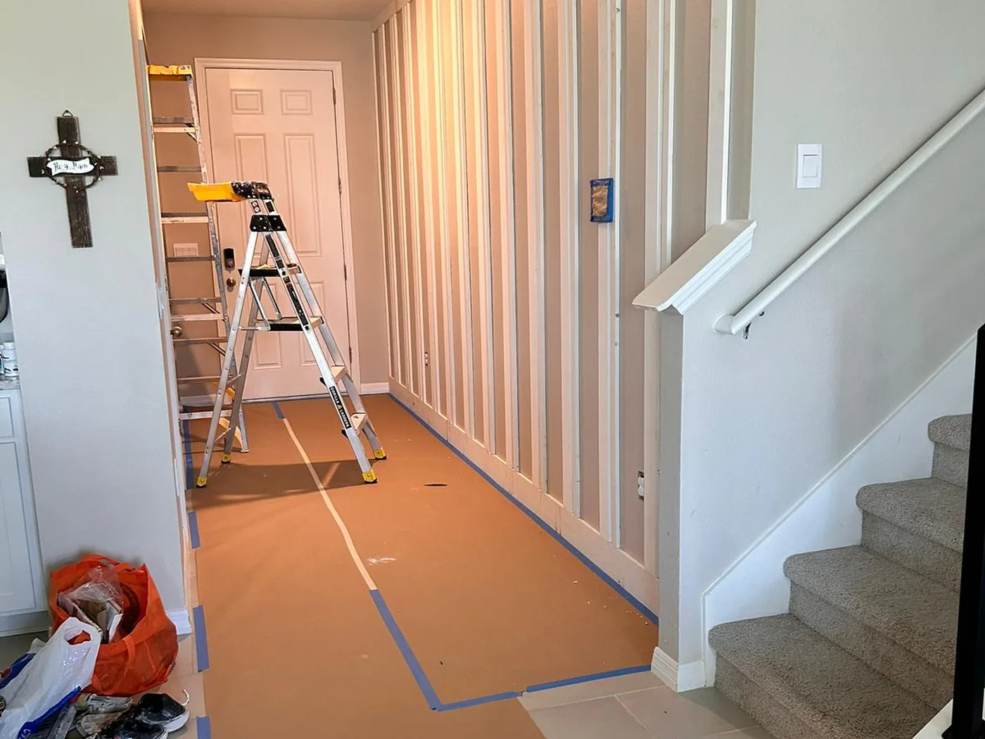 Hallway masked off with paper and tape before the battens are painted