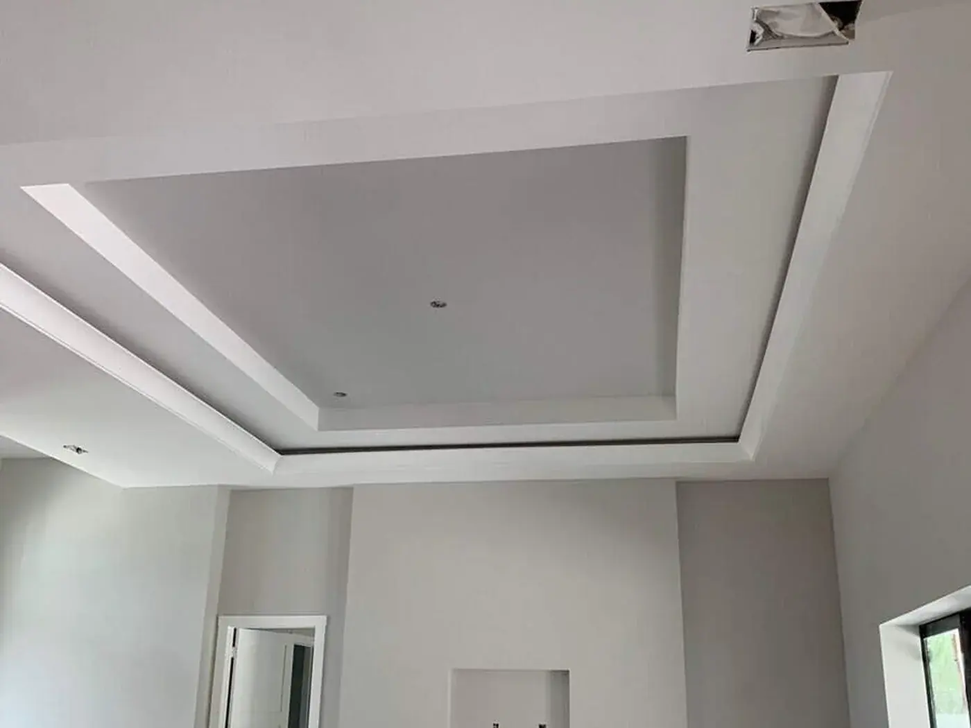 Stepped tray ceiling and the recess below it, cut in by hand