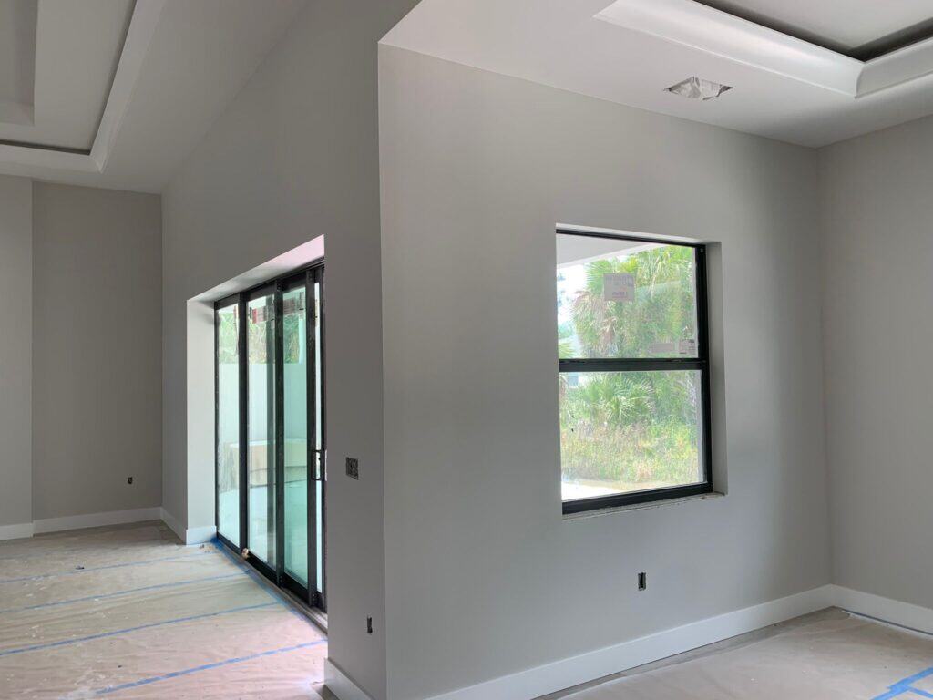 Interior wall painting in modern living space with neutral gray tones