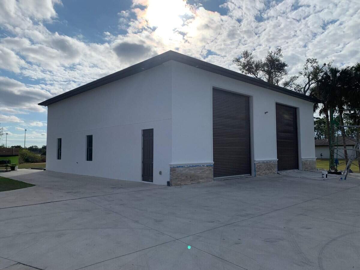 Commercial exterior painting in South Florida on industrial building