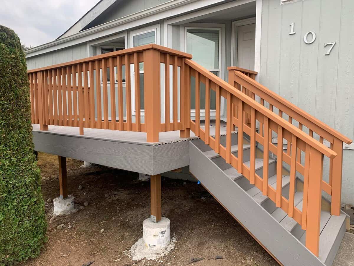 Deck staining service in South Florida on residential wooden deck with railing